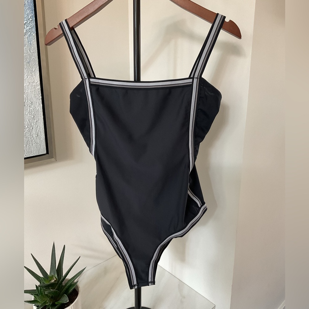 Industry Black Swimsuit with Striped trim and mesh sides.